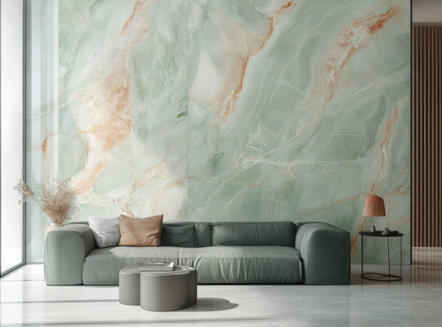 A modern living room showcasing a green marble accent wall with a minimalist sofa set. the design exudes elegance and luxury, enhanced by natural light through large glass windows.